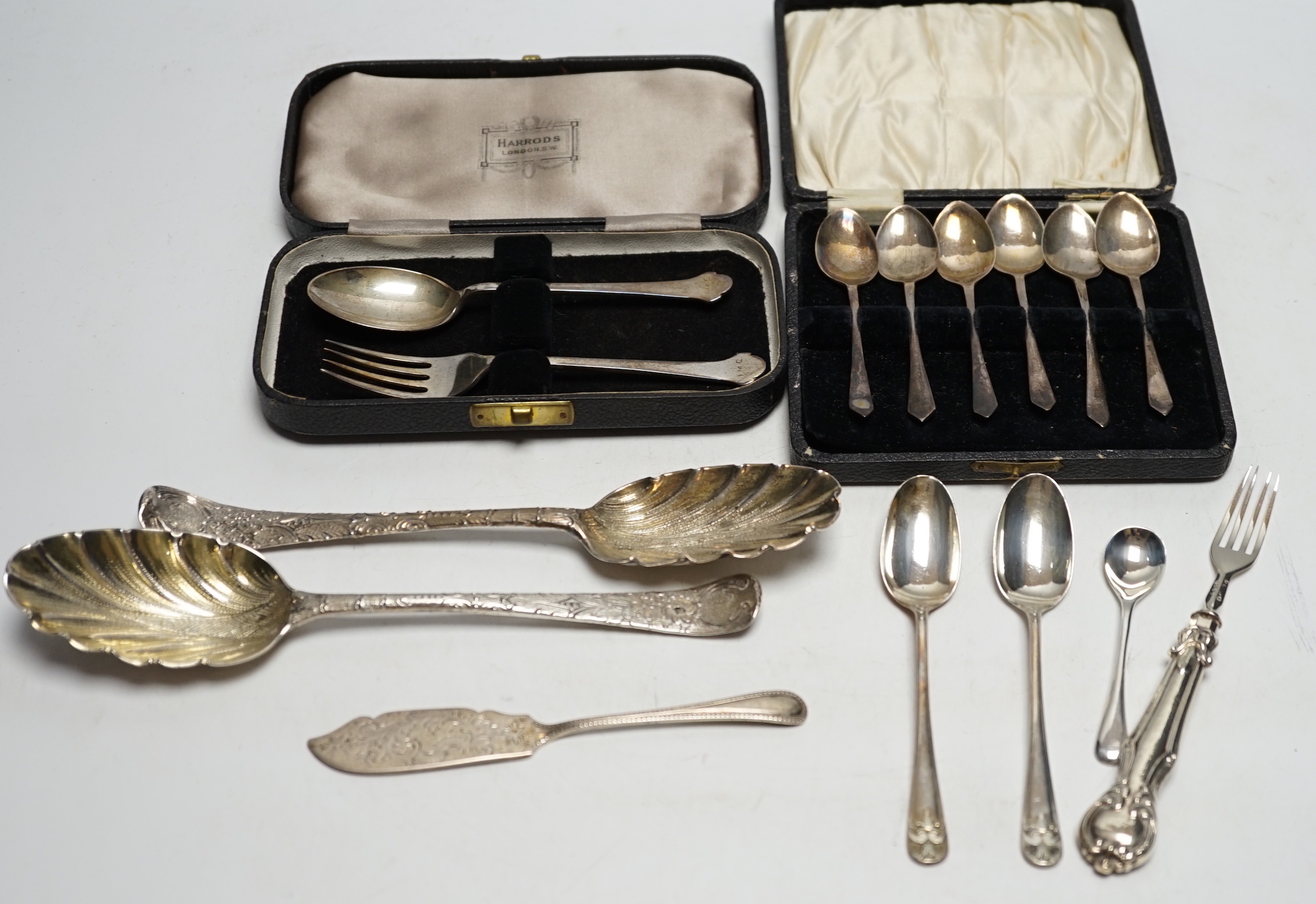 Assorted silver and white metal flatware, including four 18th base mark silver spoons, 20cm, cased coffee spoons and christening pair, rustic sugar tongs, caddy spoons, George III meat skewer and a 19th century Russian 8